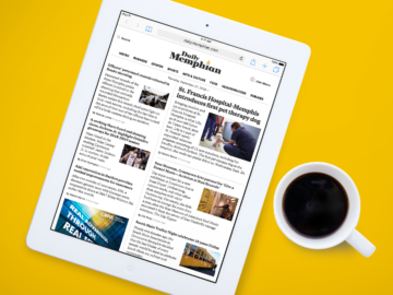 The Daily Memphian website on an ipad next to coffee cup